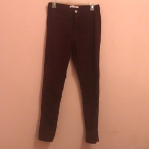 High waisted maroon jeans